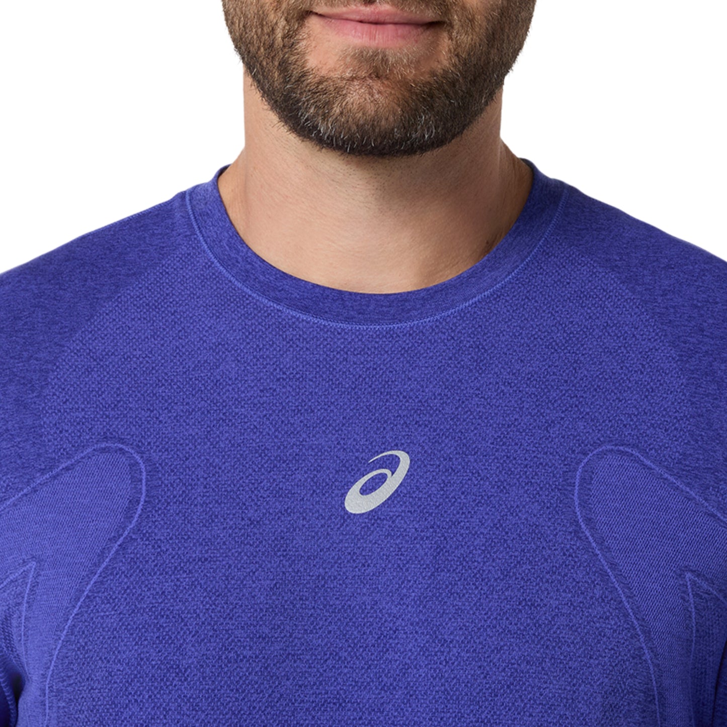 Close-up of a man wearing a long sleeve blue shirt on a white background 