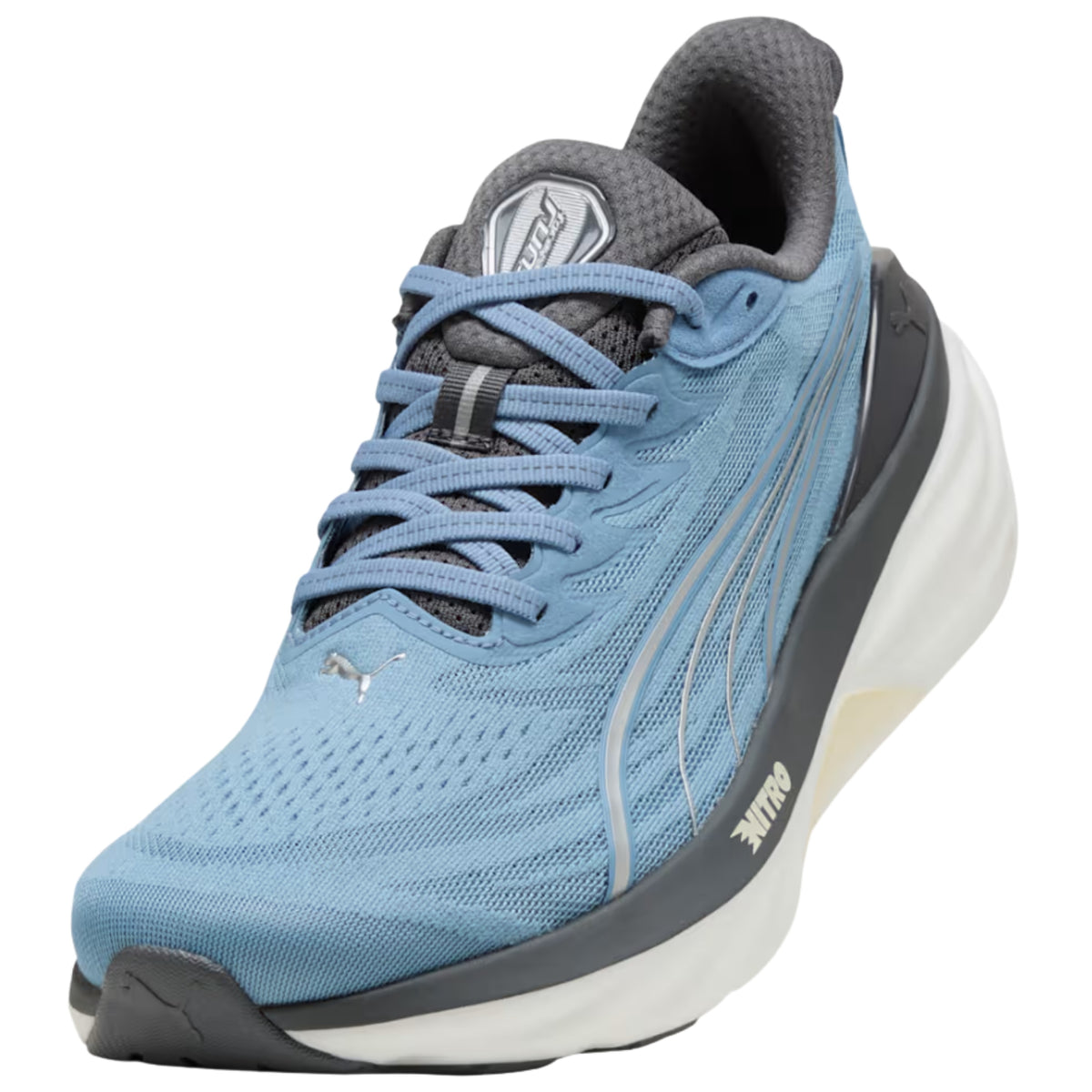 A light blue and dark gray Puma running shoe with a thick white and beige midsole, shown from a three-quarters angle on a white background.