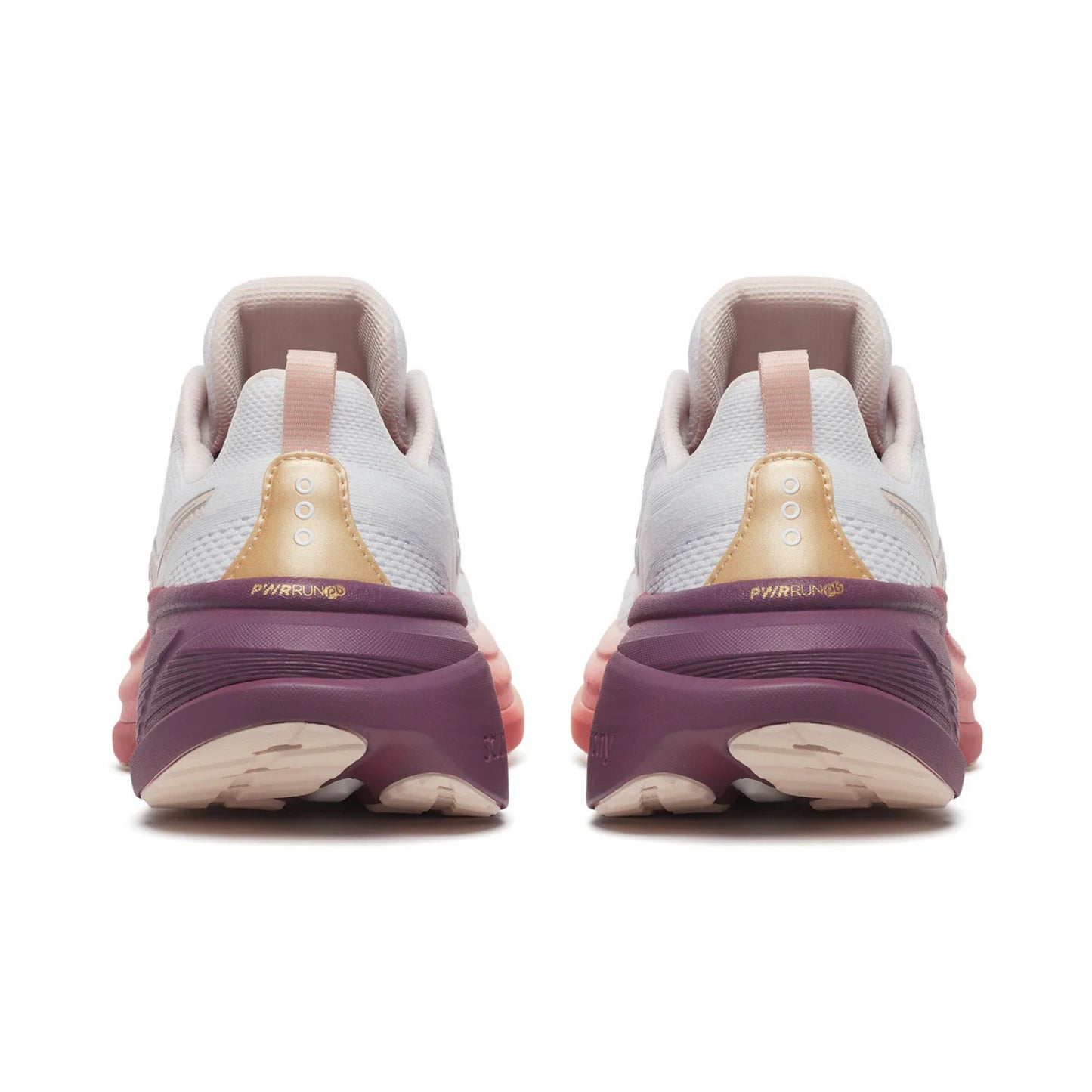 Pair of running shoes with a focus on the sole design on a white background