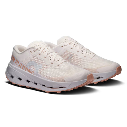 A pair of On running shoes in off-white mesh with a light gray logo on the side and a dusty rose outsole, shown against a plain white background.