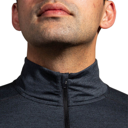 Close-up of a man wearing a long sleeve jersey on a white background