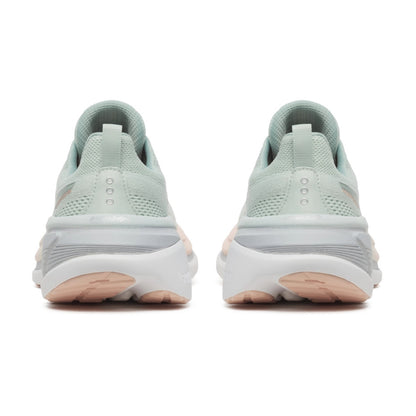 Pair of light green Saucony running shoes with white soles on a white background