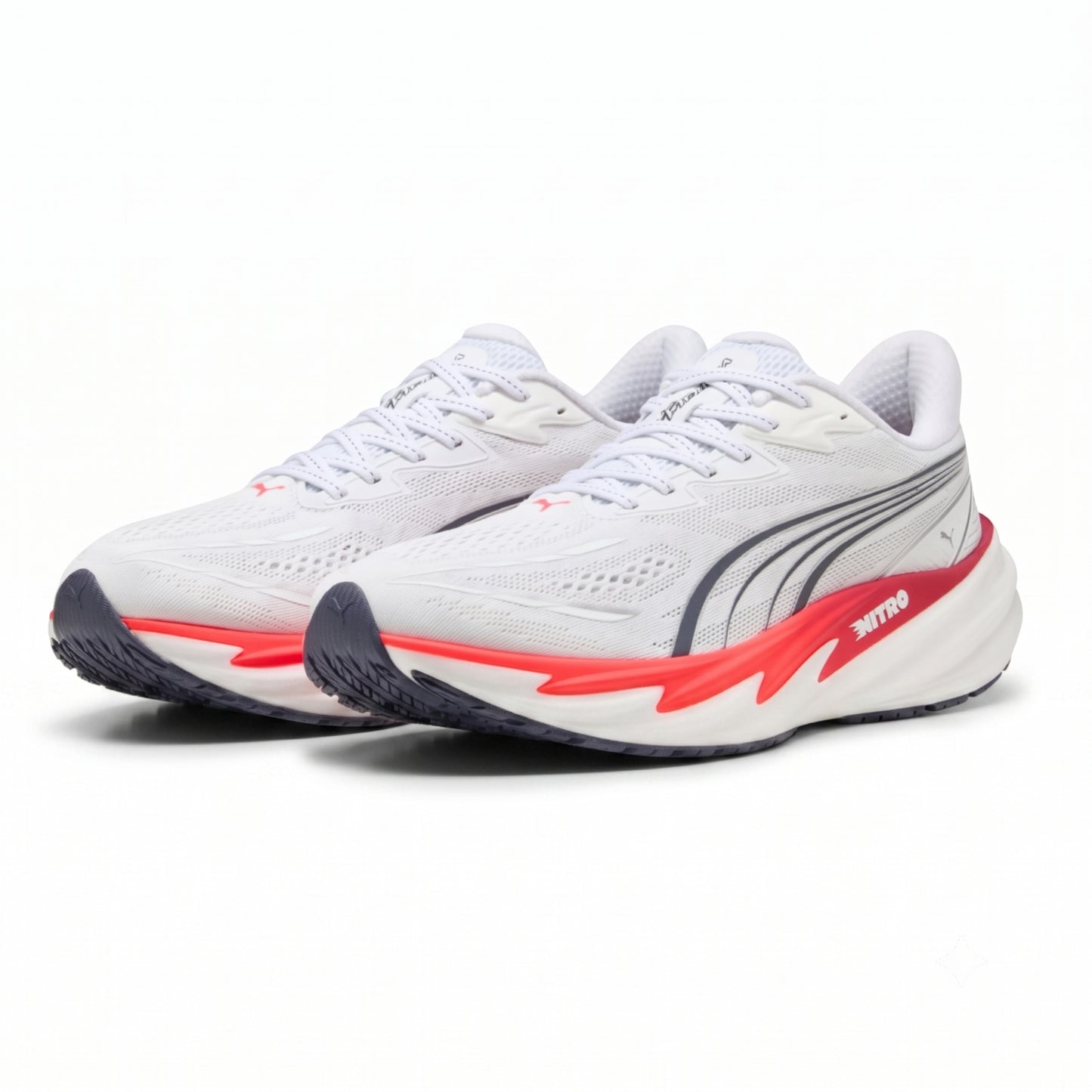 A pair of Puma running shoes in white, featuring a white mesh upper, a white and red midsole, and a dark gray outsole.