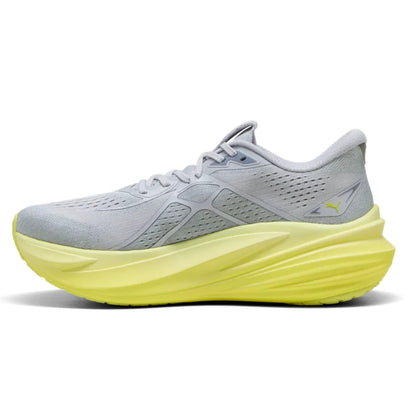 Gray and yellow Puma running shoe with a yellow sole on a white background
