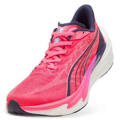 Pink Puma running shoe with a white sole on a white background