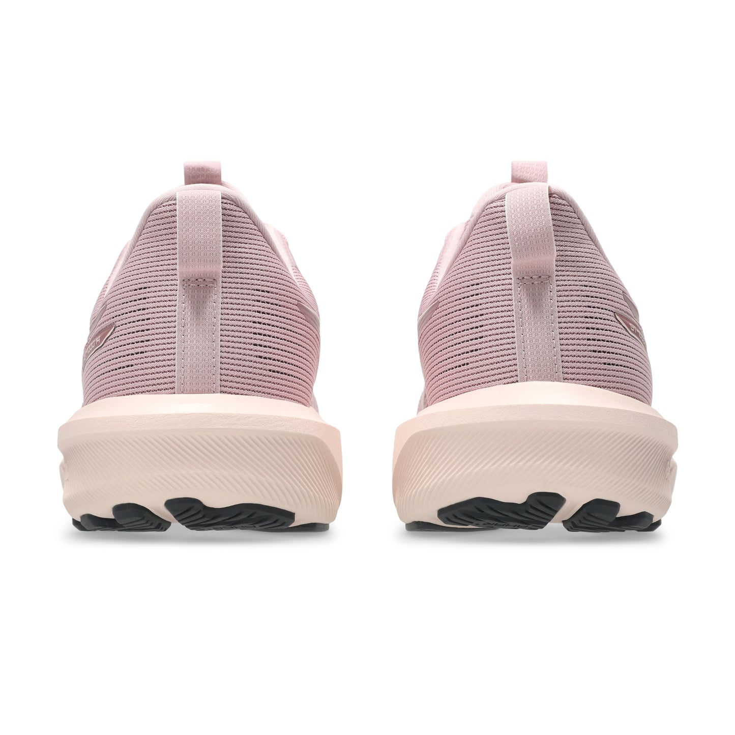 Pink running shoes with a white sole on a white background