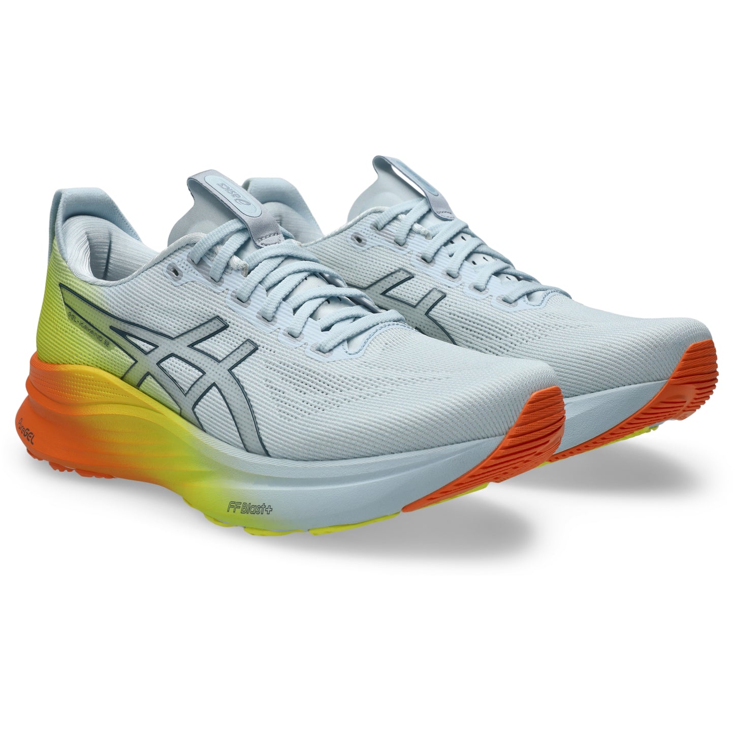 Pair of White and yellow Asics running shoe with orange accents on a white background
