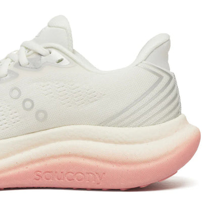 White Saucony running shoe with pink sole on a white background