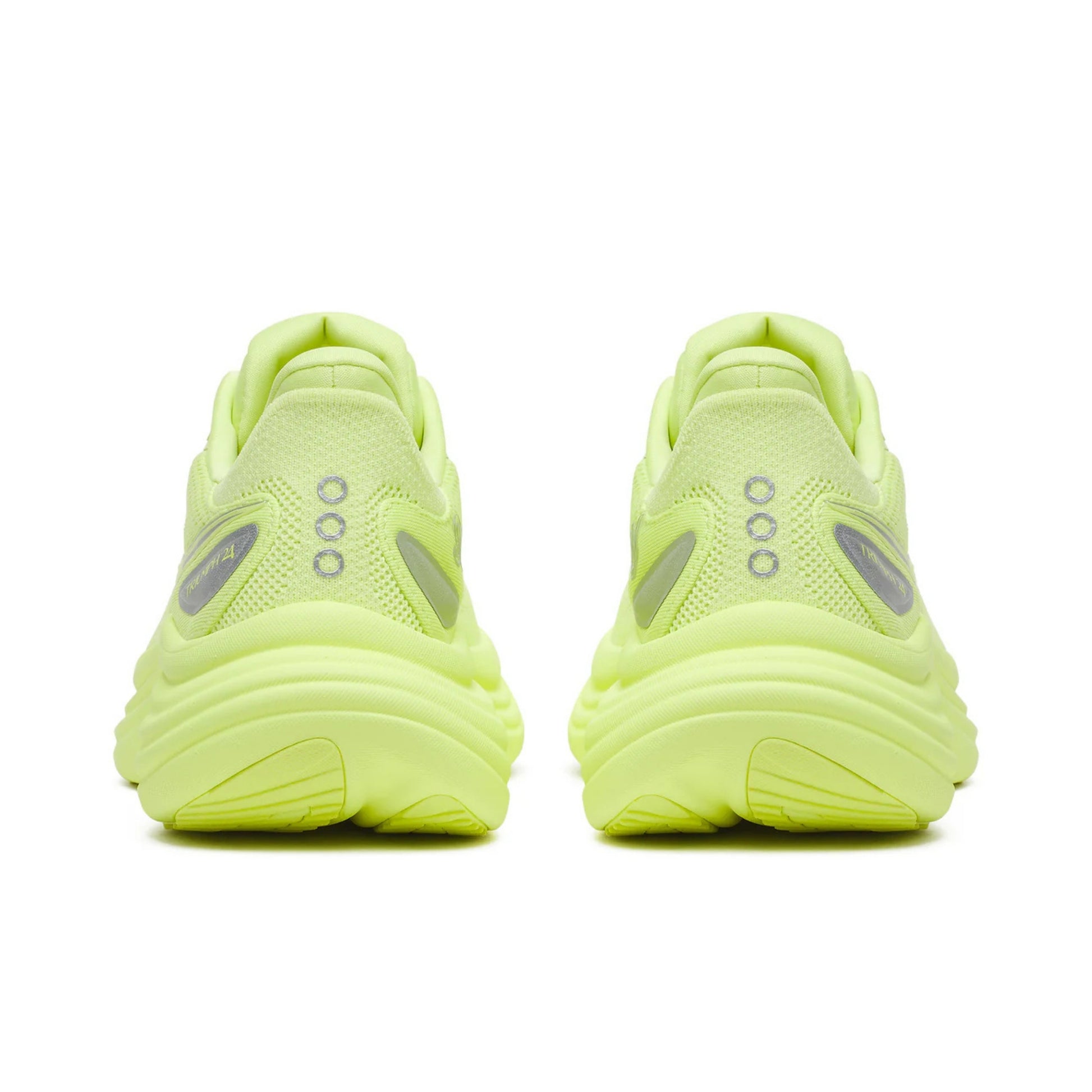 Pair of neon green Saucony running shoes on a white background
