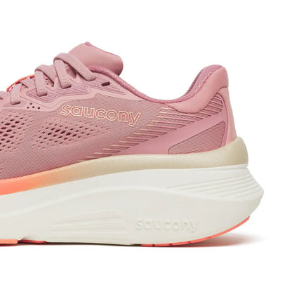 Pink Saucony running shoe with 'saucony' branding on a white background
