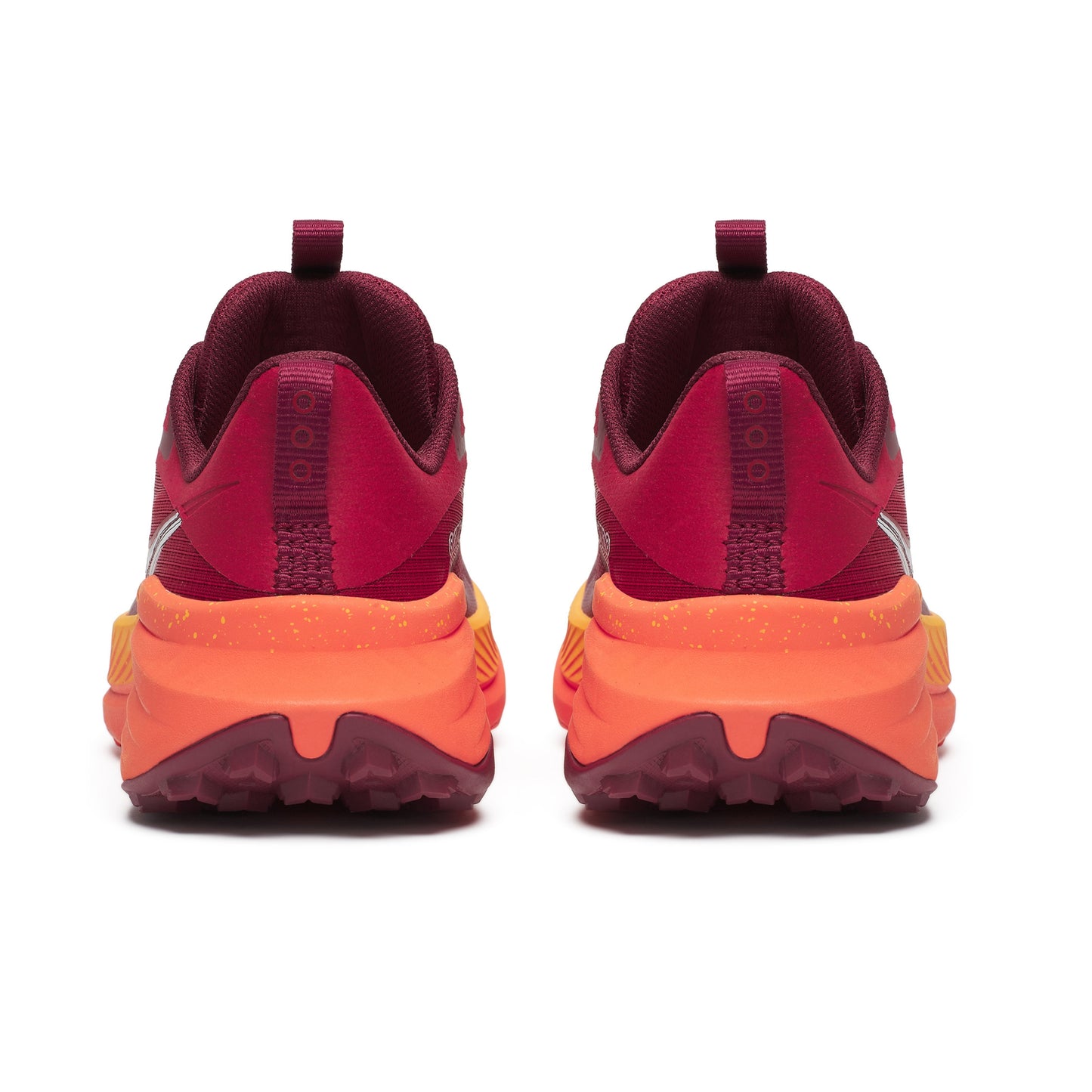 Maroon and orange athletic shoes on a white background