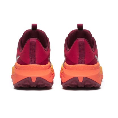 Maroon and orange athletic shoes on a white background