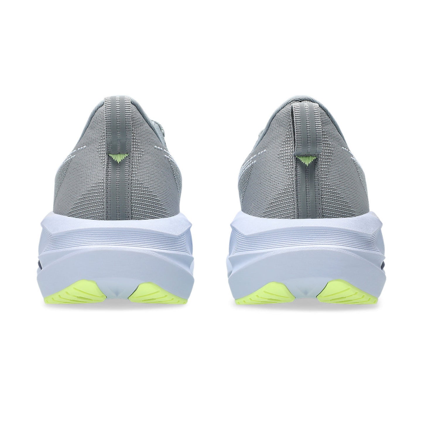 Gray running shoes with white soles and green accents on a white background