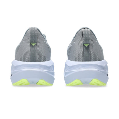 Gray running shoes with white soles and green accents on a white background