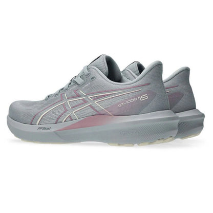 Gray Asics running shoes with a slight pinkish tint on a white background