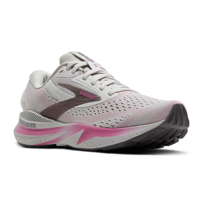 White and pink running shoe with 'Brooks' branding on a white background