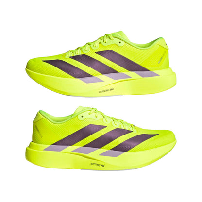 Pair of bright yellow adidas running shoes with black stripes on a white background