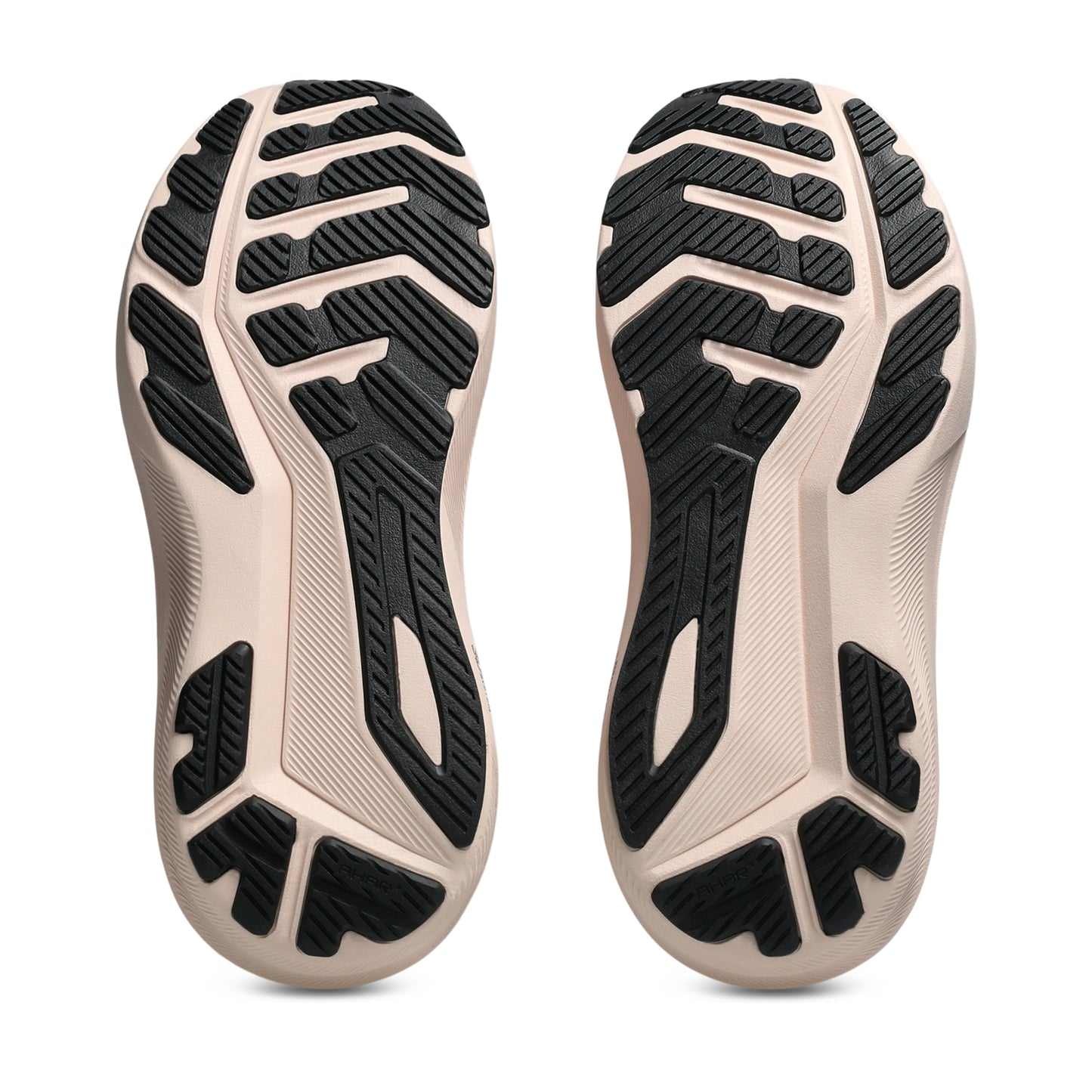 Close-up of the sole of a shoe with black tread pattern on a white background
