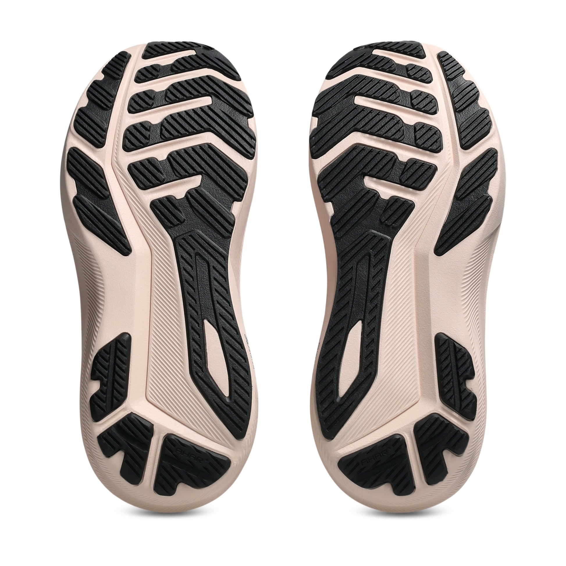 Close-up of the sole of a shoe with black tread pattern on a white background