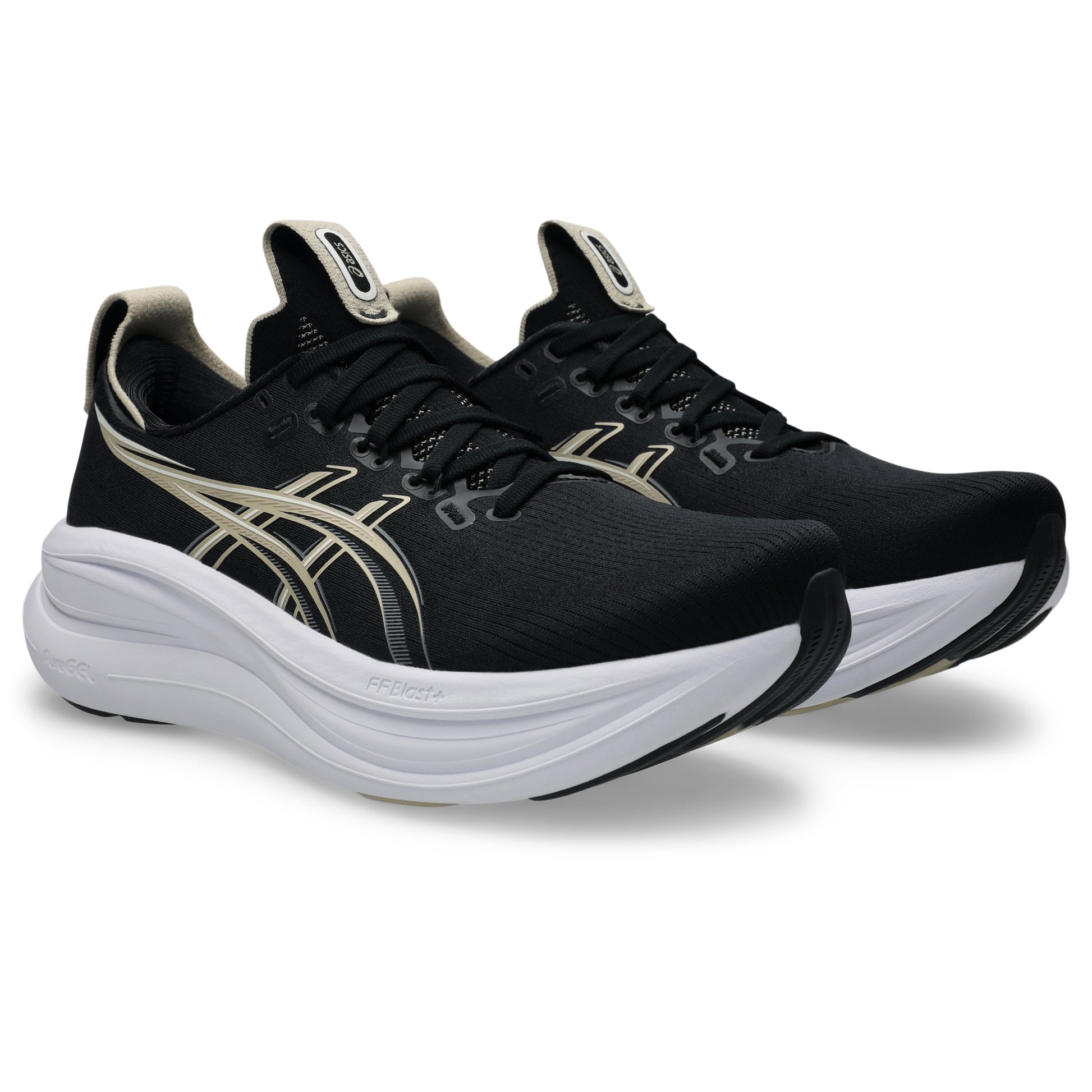 Black Asics running shoes with white soles on a white background