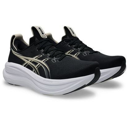 Black Asics running shoes with white soles on a white background