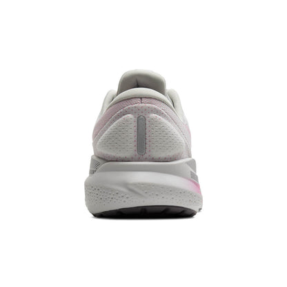 White running shoe with pink accents on a white background