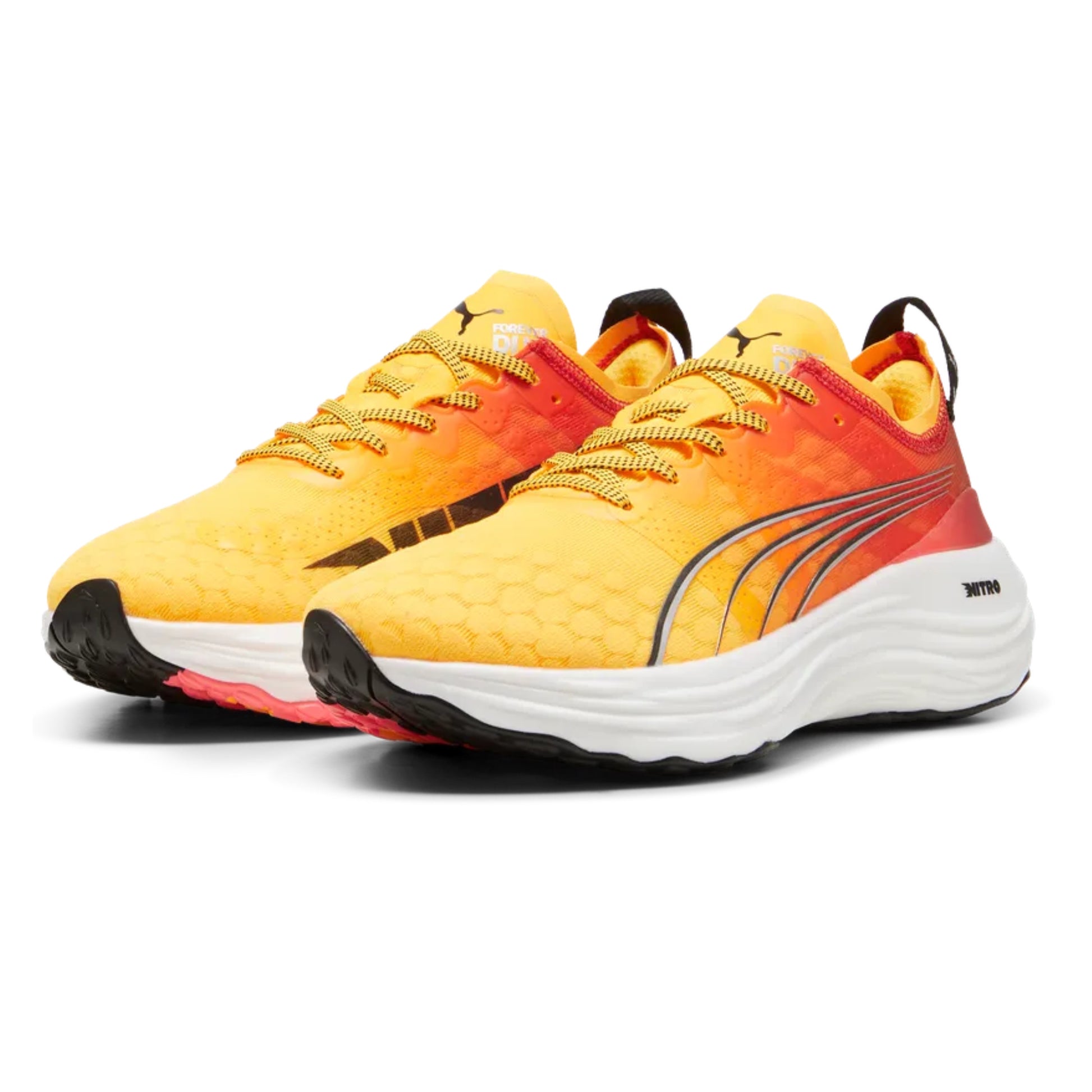 Yellow and orange Puma running shoes with black accents on a white background