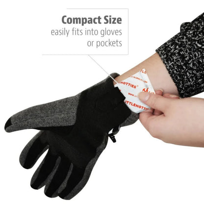Black gloves with a compact size tag, showing they easily fit into gloves or pockets.
