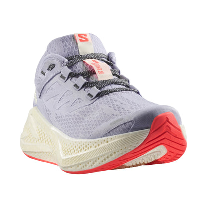 Light purple Salomon running shoe with red sole on a white background