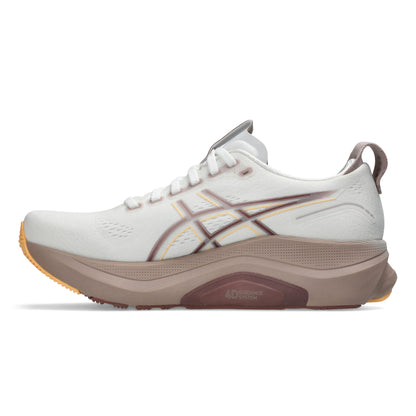White running shoe with brown sole on a white background