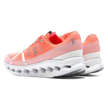 White/Flame running shoe with logo on the side on a white background