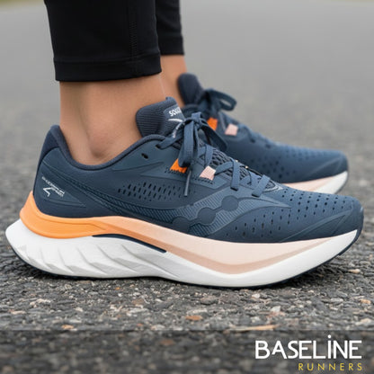 Dusk/Peel Saucony running shoe with orange and light pink gradient sole