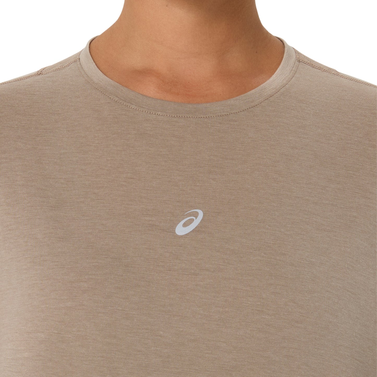 Close-up of a person wearing a heather taupe athletic t-shirt with a small white Asics logo on the chest, set against a plain white background.