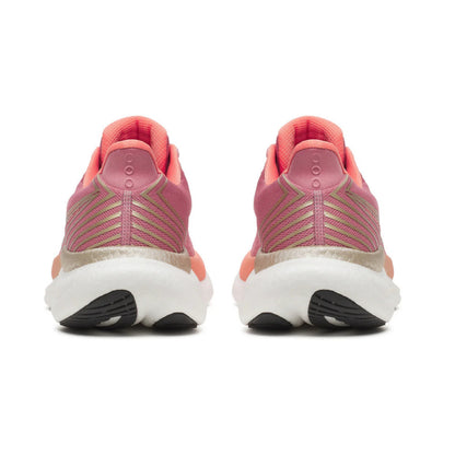 Pink Saucony running shoes with a white sole on a white background