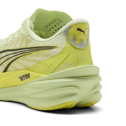 Yellow Puma running shoe with Puma logo on a white background