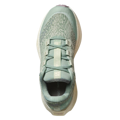 Light green Salomon running shoe on a white background