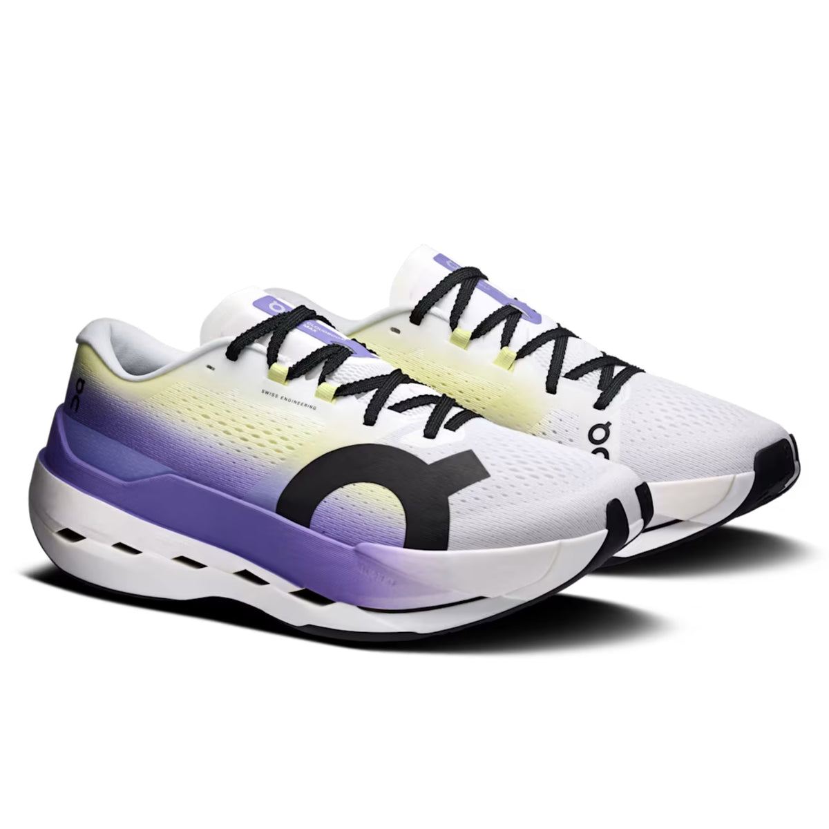 A pair of On running shoes in white, purple, and yellow, featuring a prominent black On logo on the side, black laces, and a white and black sole, set against a plain white background.