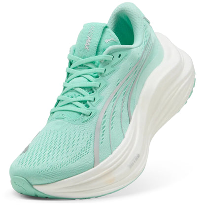 Mint green running shoe with white sole on a white background