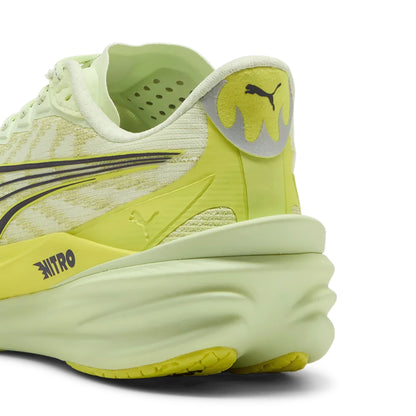 Yellow Puma running shoe with Puma logo on a white background