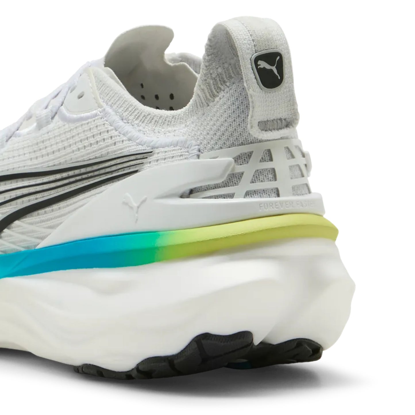 White running shoe with blue and yellow accents on the sole on a white background