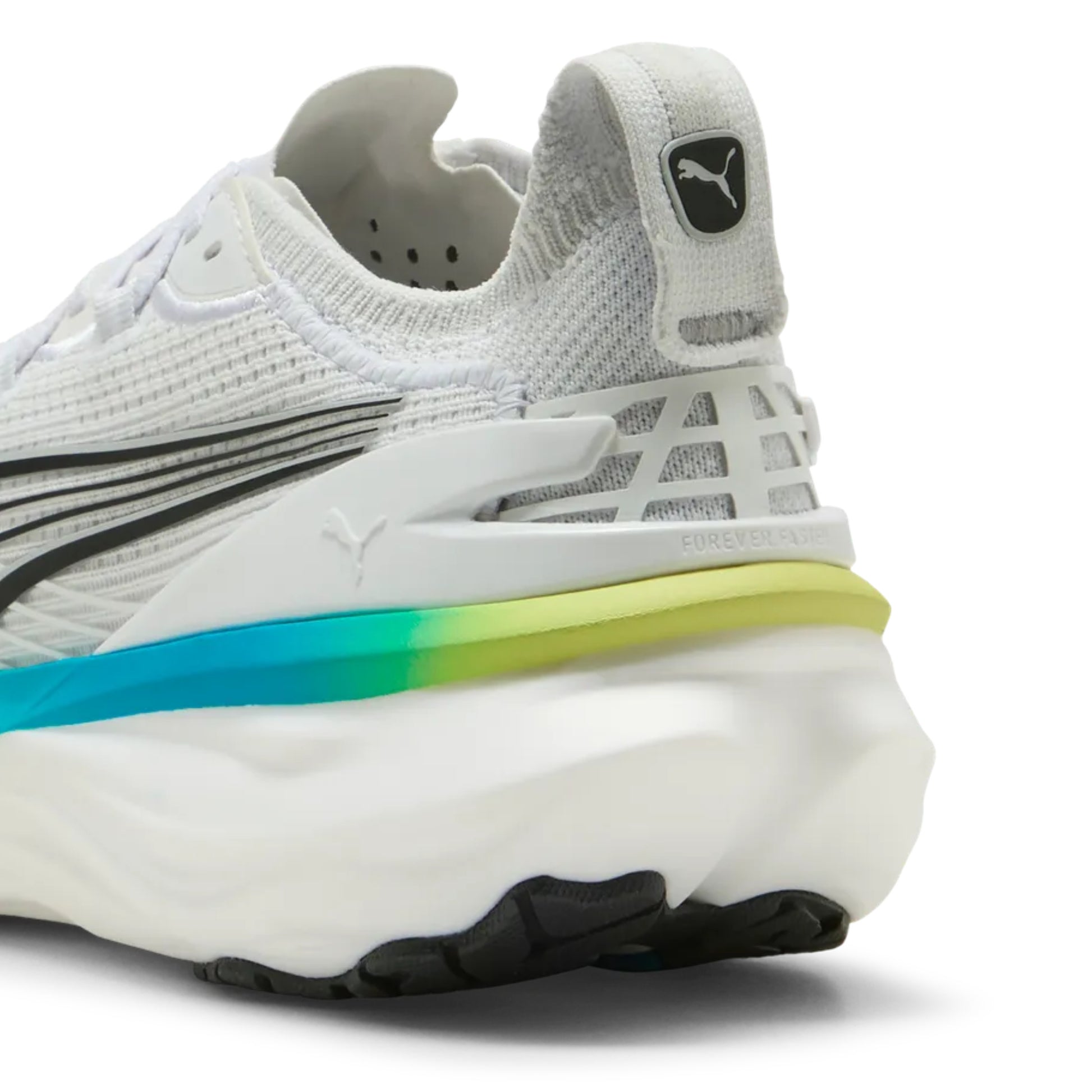 White running shoe with blue and yellow accents on the sole on a white background