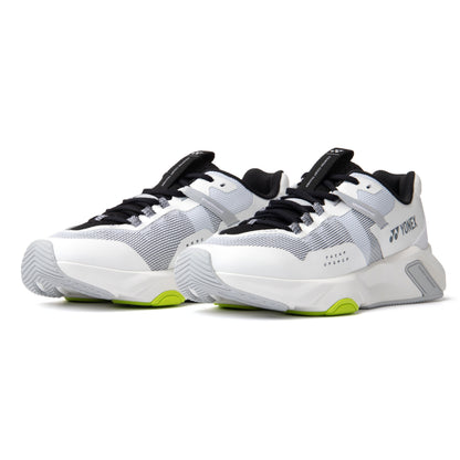 White and black Yonex running shoes with green accents on a white background