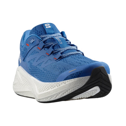 Blue Salomon running shoe with white sole on a white background