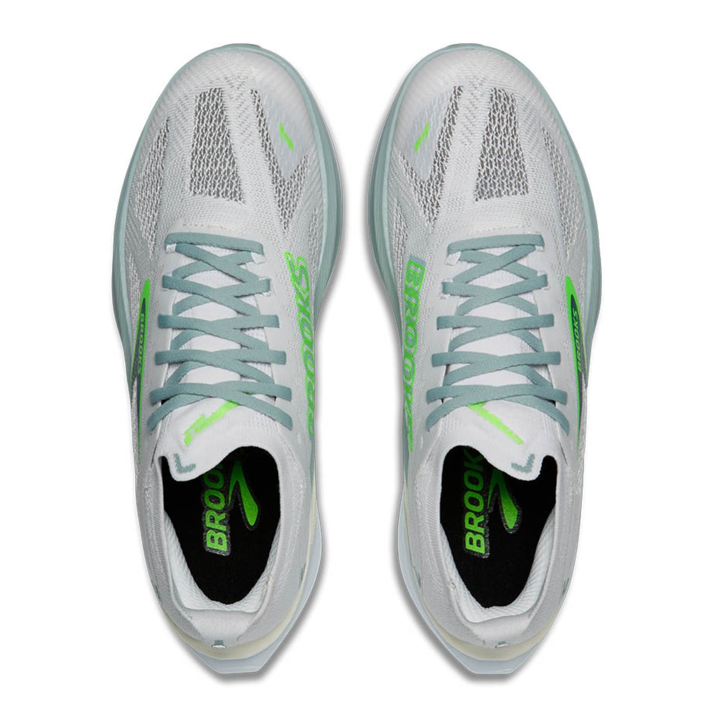 White Brooks running shoes with green accents on a white background