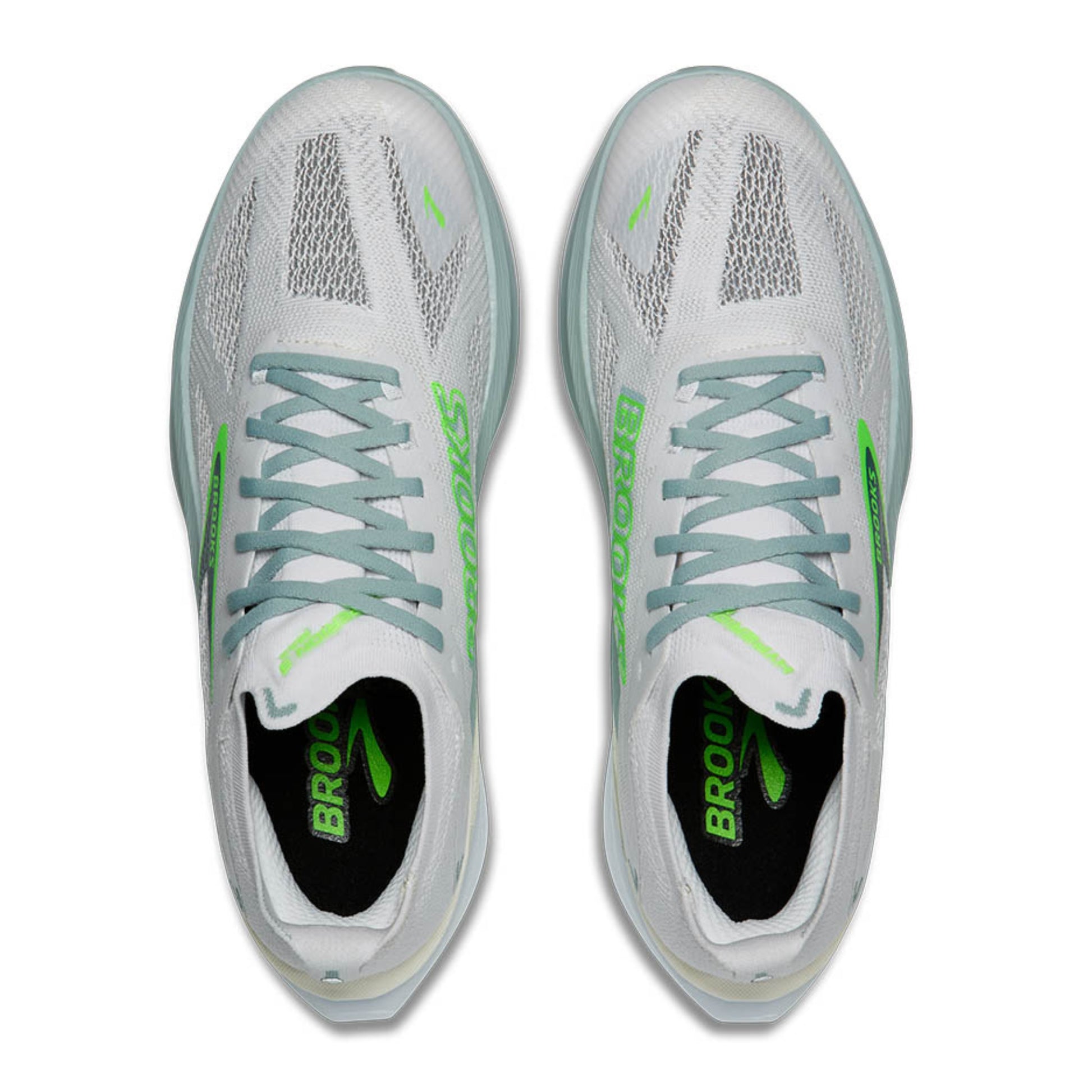 White Brooks running shoes with green accents on a white background