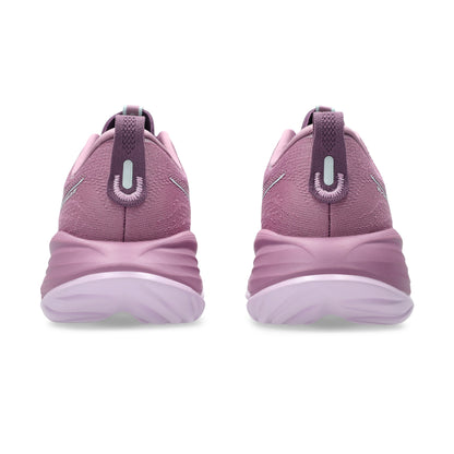 Pair of pink Asics running shoes on a white background