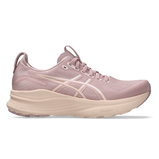 Pink running shoe with a white sole on a white background