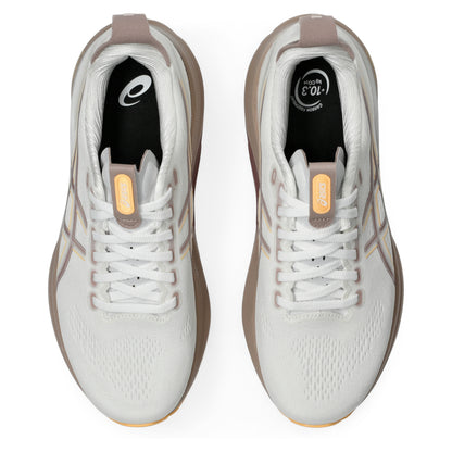 White running shoes with brown accents on a white background