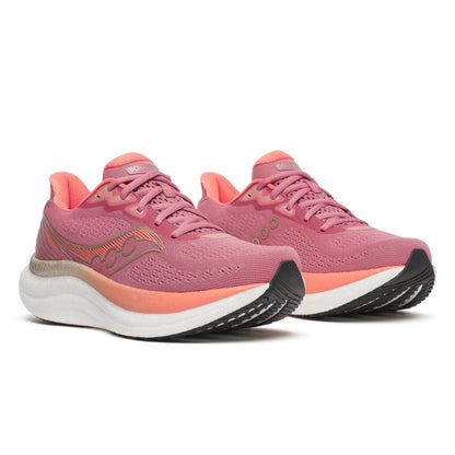 Pink Saucony running shoes with a white sole on a white background