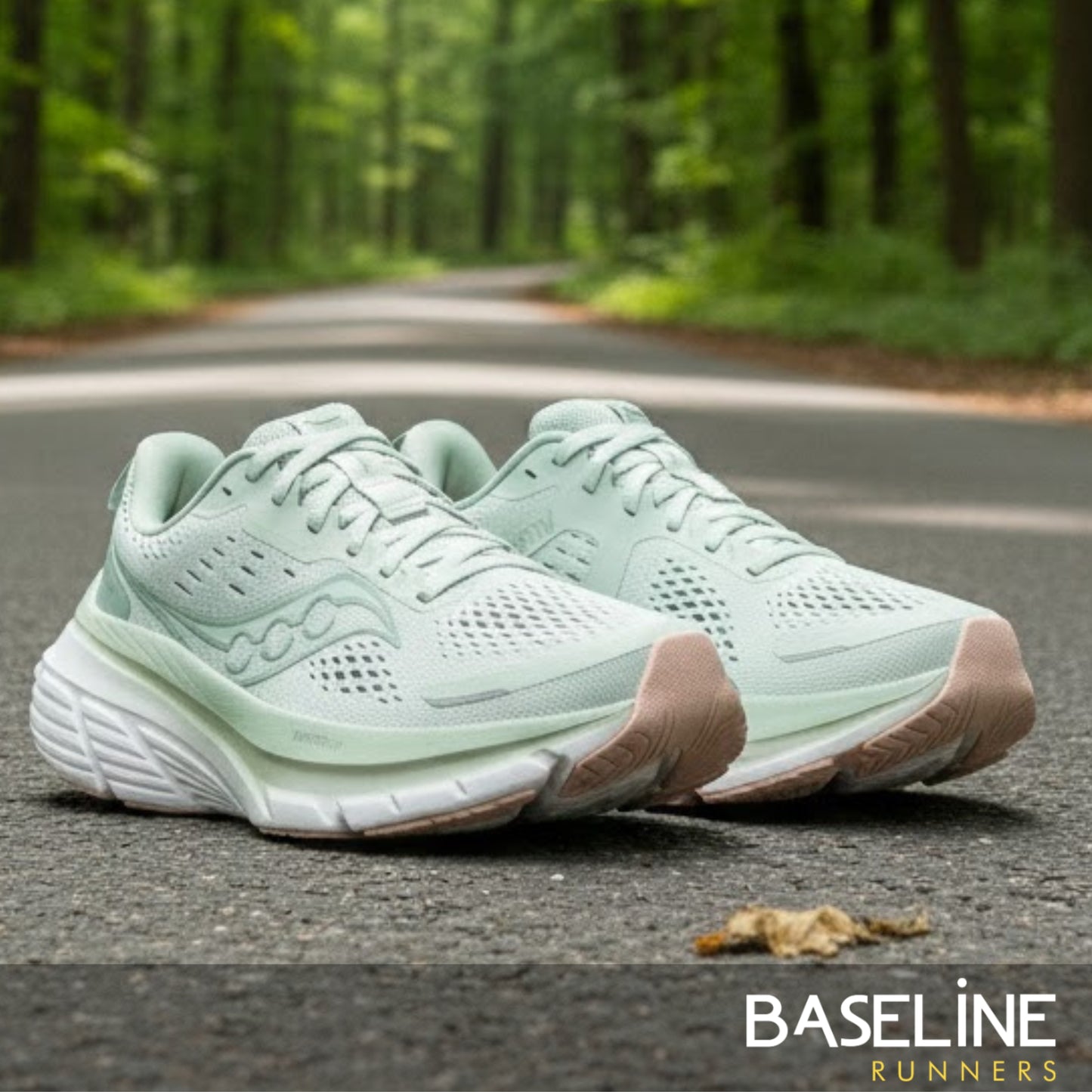 Pair of light green running shoes on a road with a forest background, featuring the 'Baseline Runners' brand.